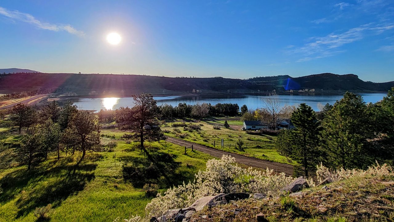 Sun over reservoir from trails_hi-res